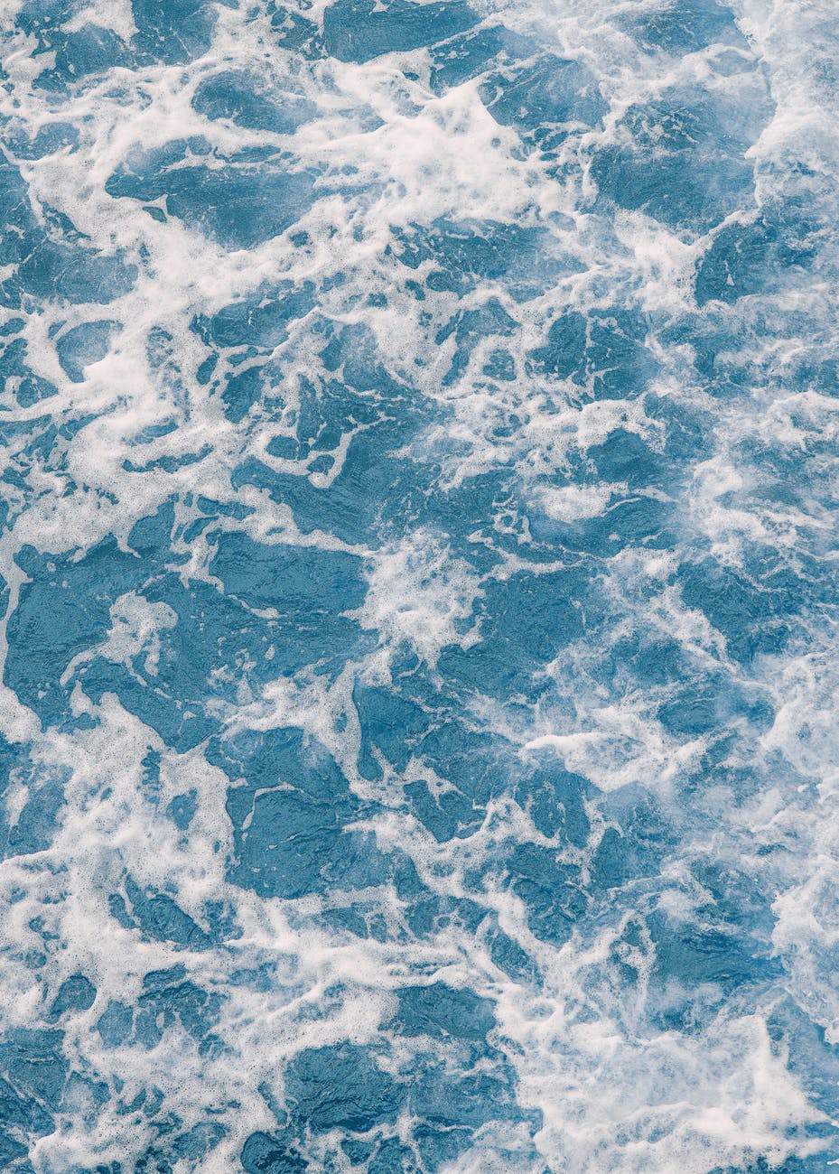 Foamy blue sea with powerful waves signify the flow state or a creatives place of effortless creation.