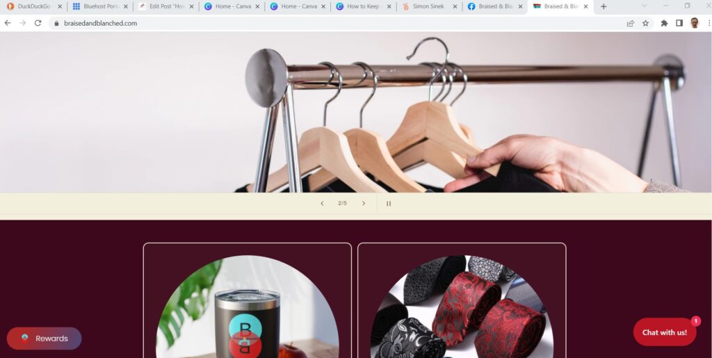 Braised and Blanched Shopify homepage with ties and cups showing. It also shows the website chat and rewards buttons. 